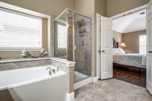 Combined shower/bathtub, hair dryer, towels, soap - Fabulous 5 Bedroom/4 bath Home  4K TV's Fireplace  Foosball! (Frisco)