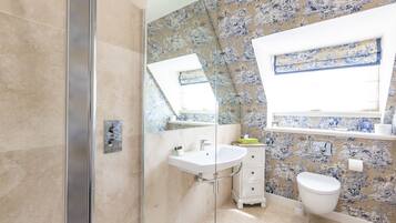 Combined shower/tub, hair dryer, towels, soap