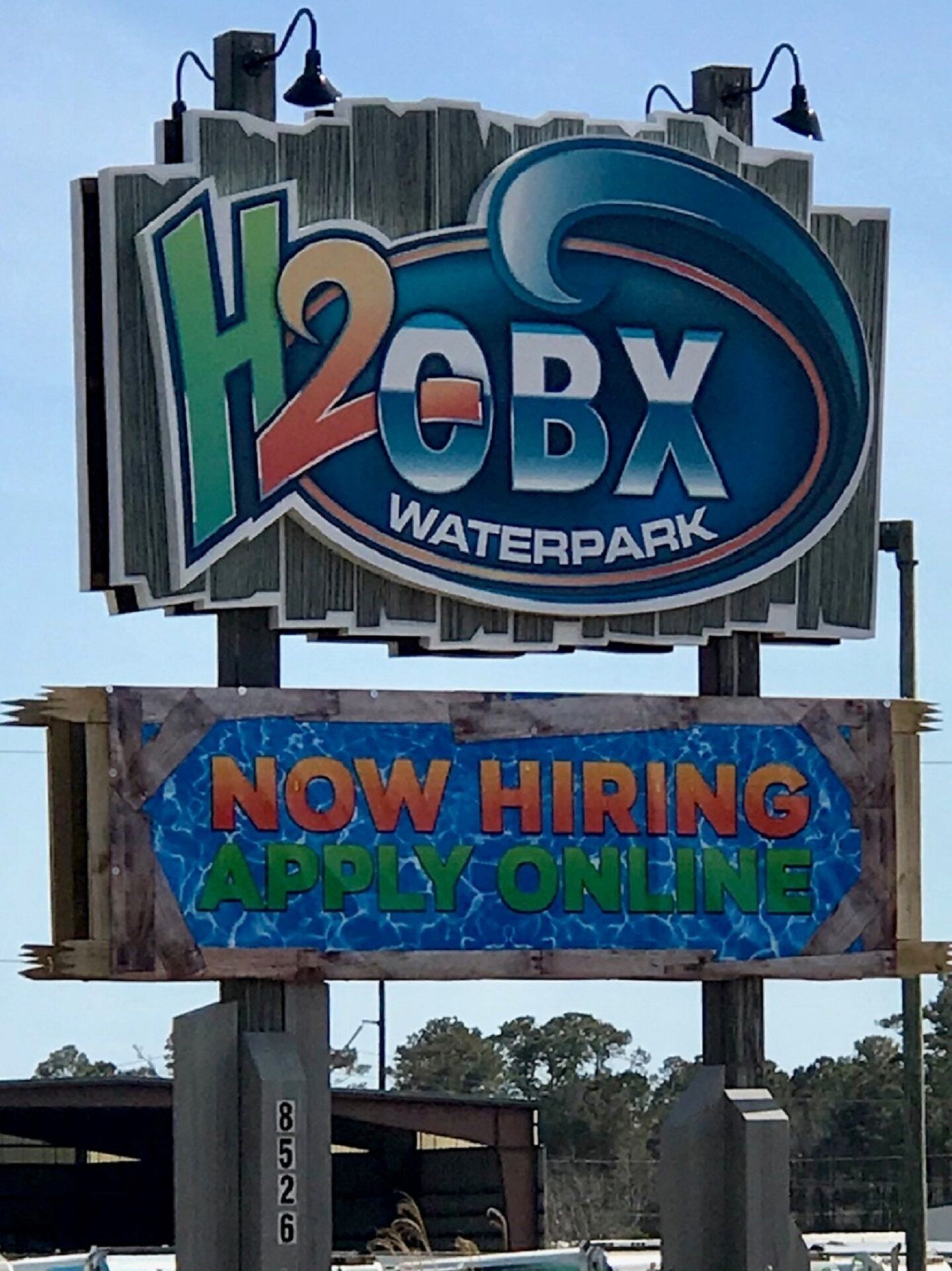 A sign for H2O BX Waterpark with a hiring notice.