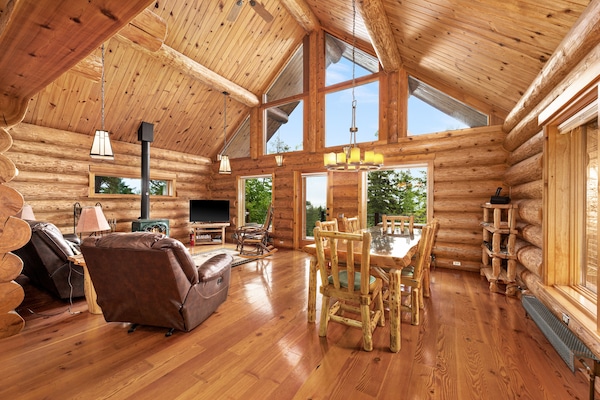 Bright and spacious living and dining area. Wood stove and Smart TV and DVD.