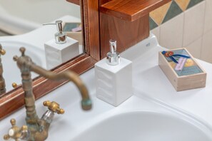 Combined shower/tub, hair dryer, towels, toilet paper