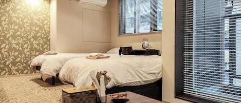 Premium bedding, down duvets, desk, laptop workspace