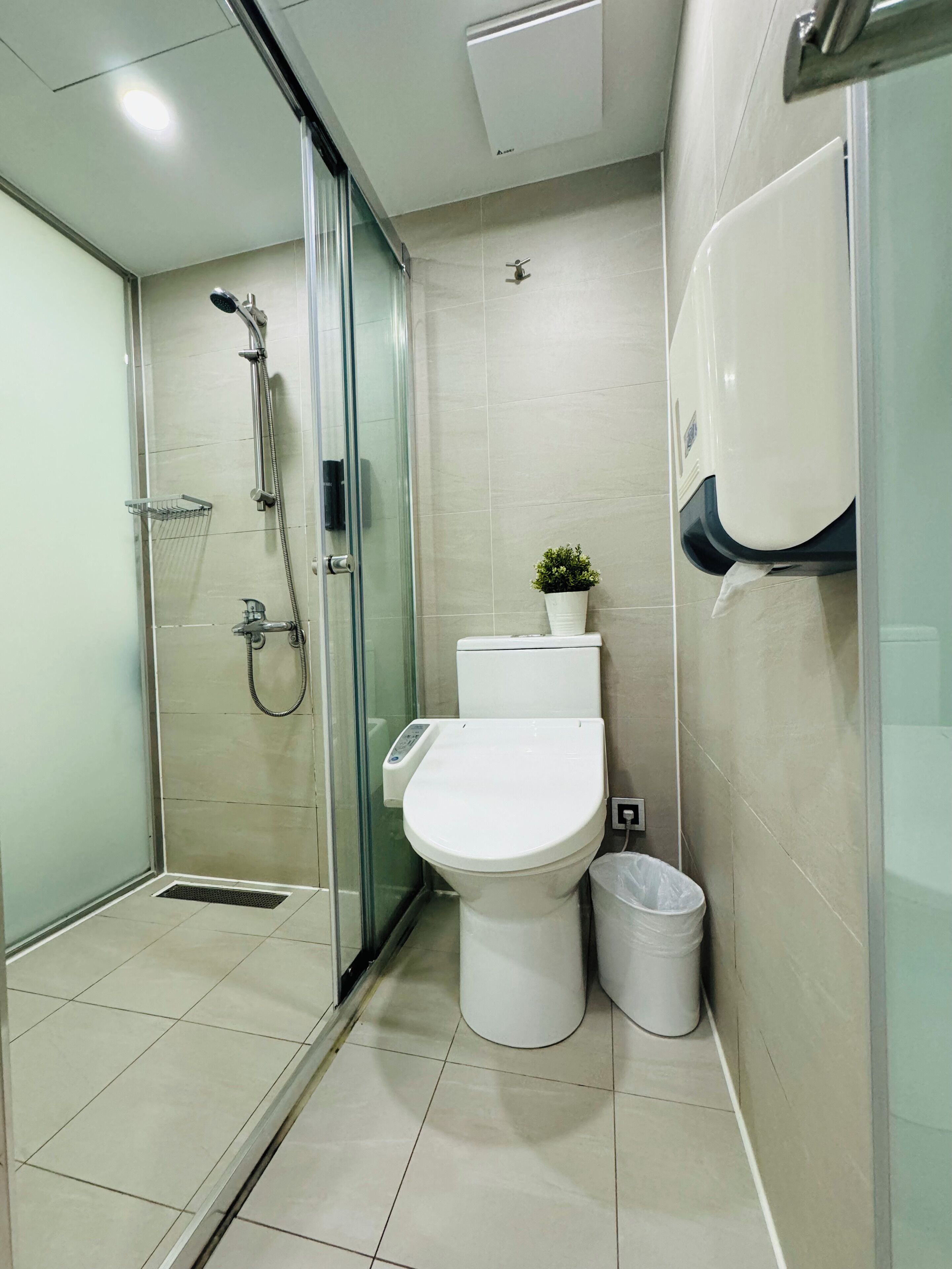 shower, rainfall showerhead, hair dryer, towels