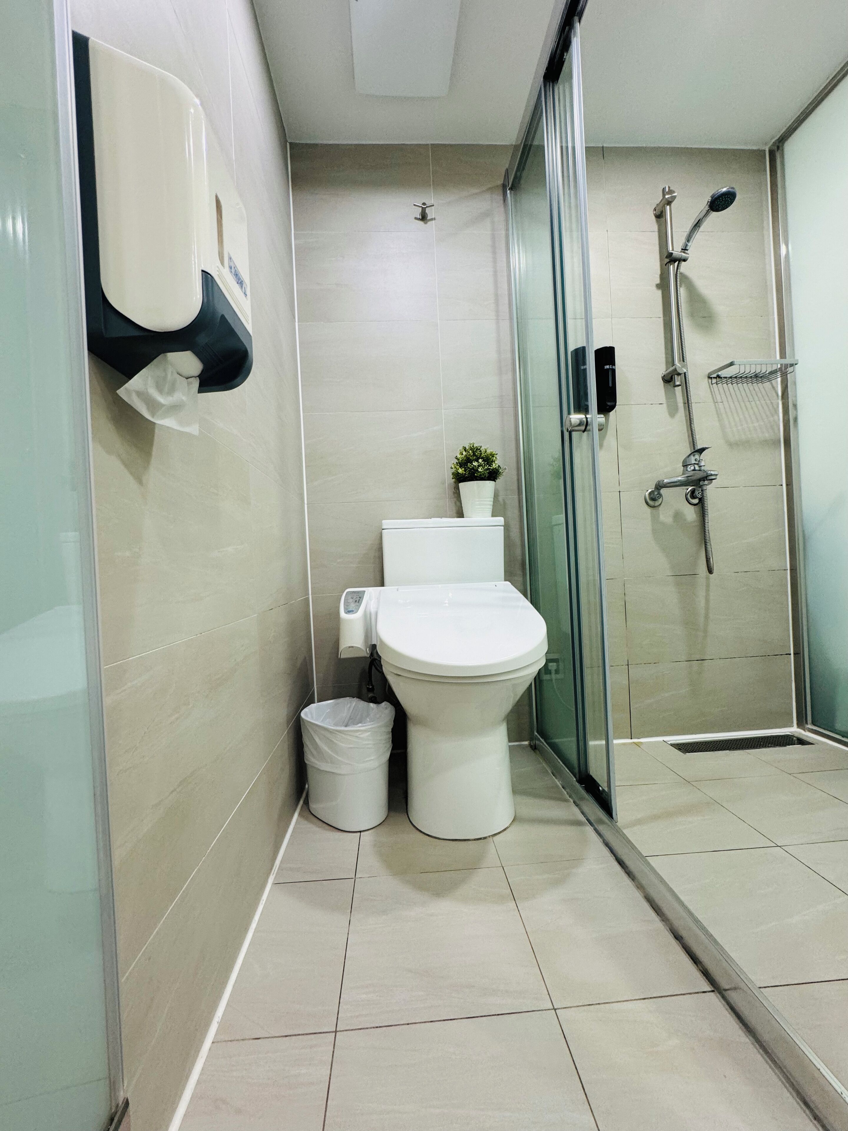 shower, rainfall showerhead, hair dryer, towels