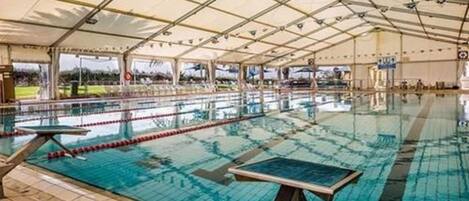 Indoor pool, open 2:00 PM to 6:00 PM, pool loungers