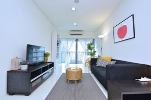 Apartment, 1 Bedroom | Living room | Flat-screen TV