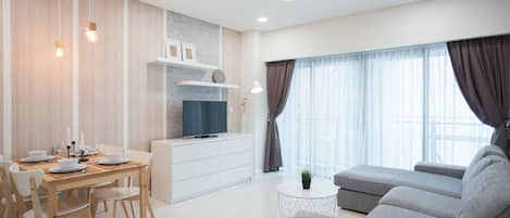 Apartment, 1 Bedroom | Living area | Flat-screen TV