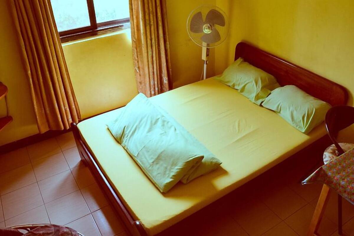 Desk, blackout curtains, bed sheets
