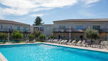 Seasonal outdoor pool, pool loungers