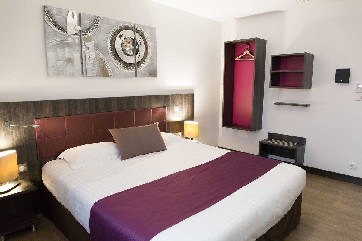 Standard Double Room | Minibar, in-room safe, desk, blackout curtains