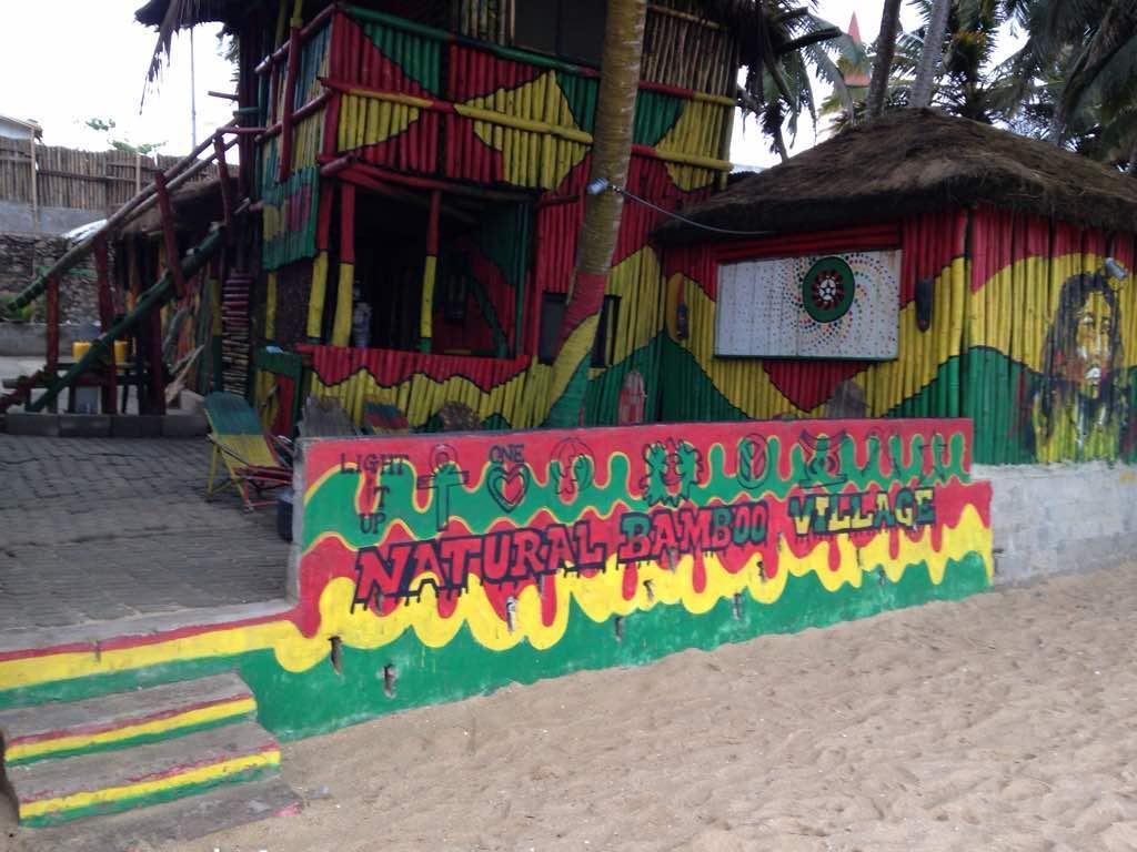 A colorful building with a sign that reads "NATURAL BAMBOO VILLAGE."