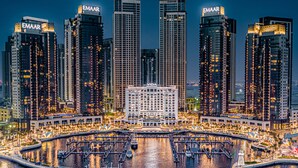A high-rise hotel complex with multiple buildings, a marina, and a central plaza. - Vida Creek Harbour (Dubai)