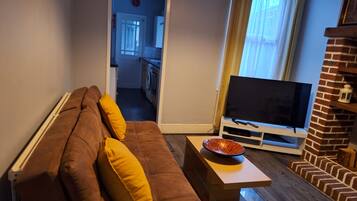 Economy House, Private Bathroom, Garden View (Contractors | Traders) | Living area | Flat-screen TV