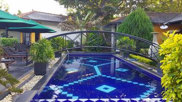 Outdoor pool, open 7:00 AM to 9:00 PM, free cabanas, pool umbrellas