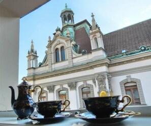 A view of a building with ornate architecture, including a tower and arched windows. - Barbo Palace (Ljubljana)