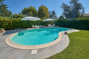 Outdoor pool, pool umbrellas, sun loungers