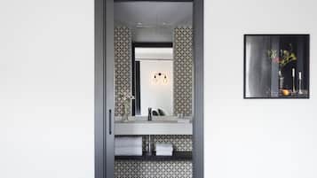 Shower, designer toiletries, hair dryer, bathrobes