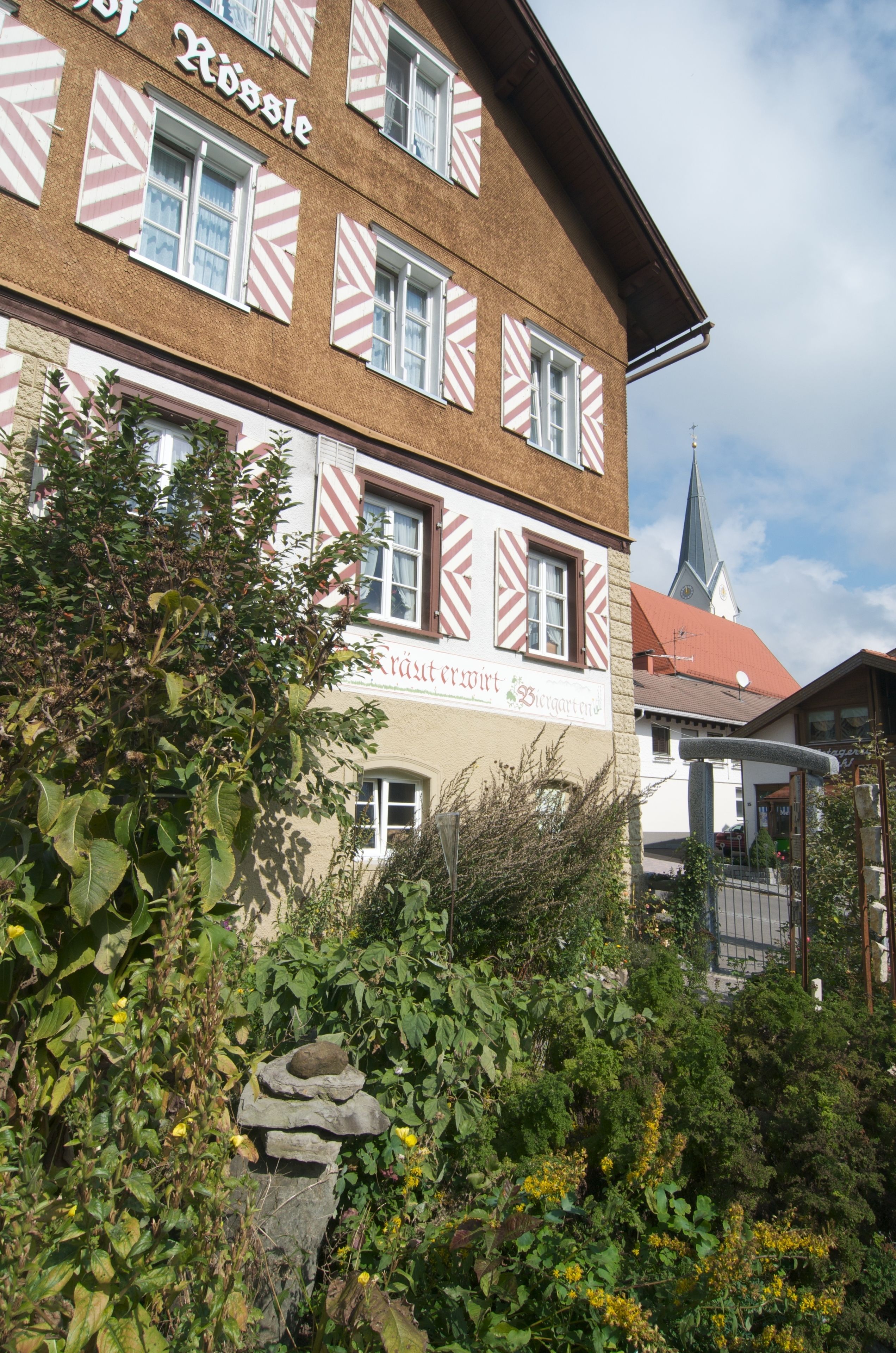 A traditional building with a sign that reads "Kräft & Wirt."