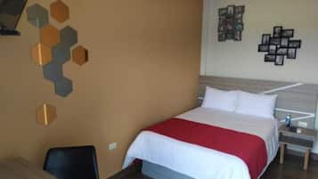 Habitación ejecutiva | Espacio para trabajar con laptop, wifi gratis y ropa de cama