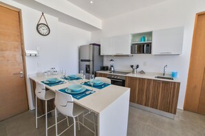 Apartment, 2 Bedrooms, Pool View | Private kitchen | Full-size fridge, microwave, oven, stovetop