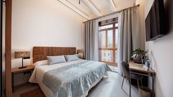 Standard Double Room | Minibar, in-room safe, desk, blackout drapes