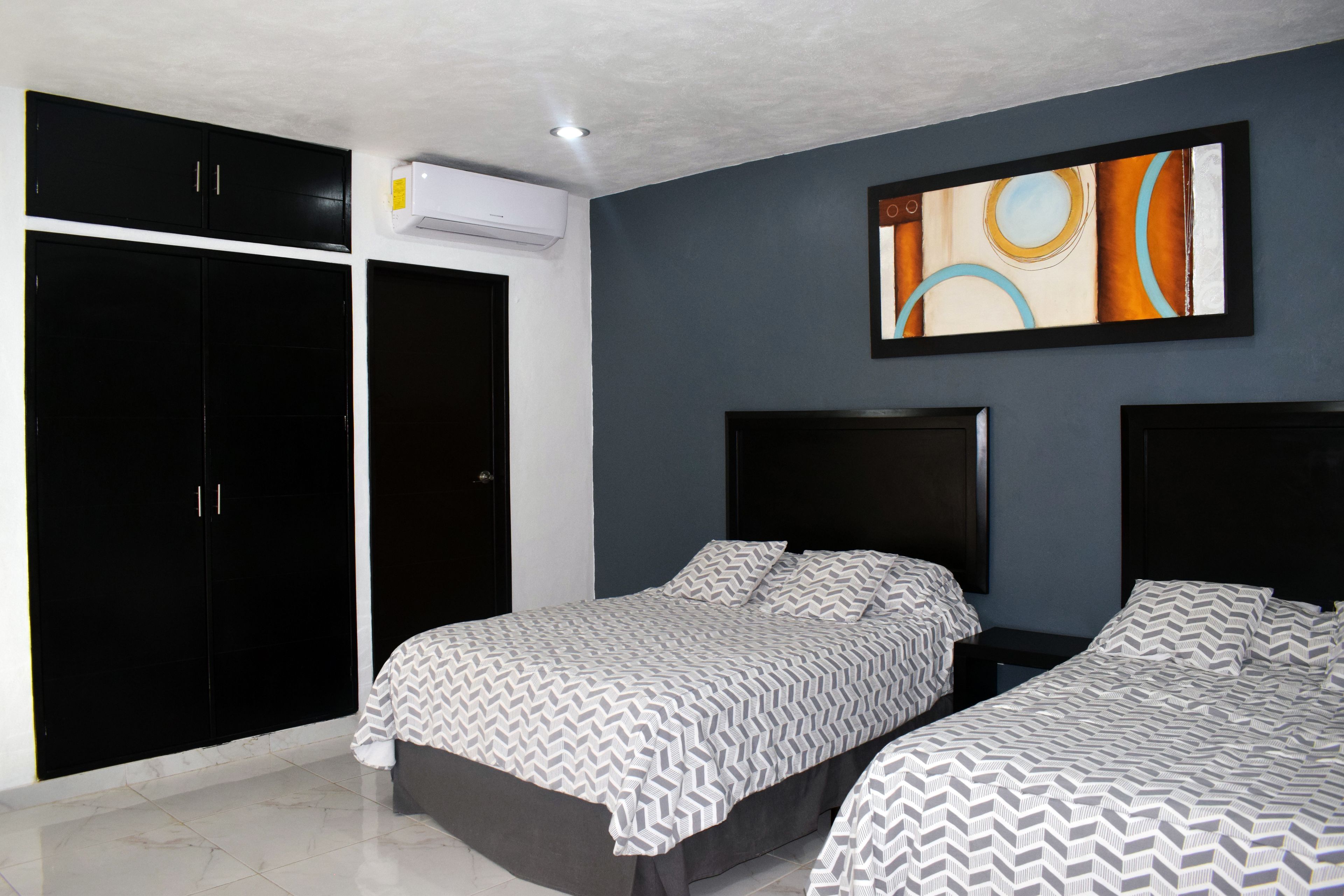 deluxe double room, 2 double beds, accessible, pool view | 2 bedrooms, minibar, individually furnished, blackout curtains