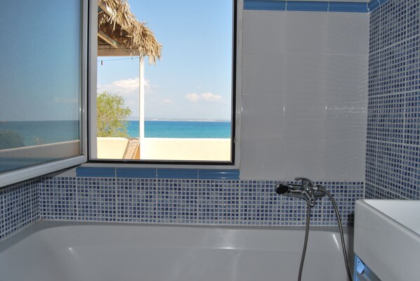 Bathtub, hair dryer, towels, soap