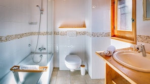 Combined shower/bathtub, hair dryer, towels, toilet paper