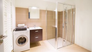 Shower, hair dryer, towels, toilet paper