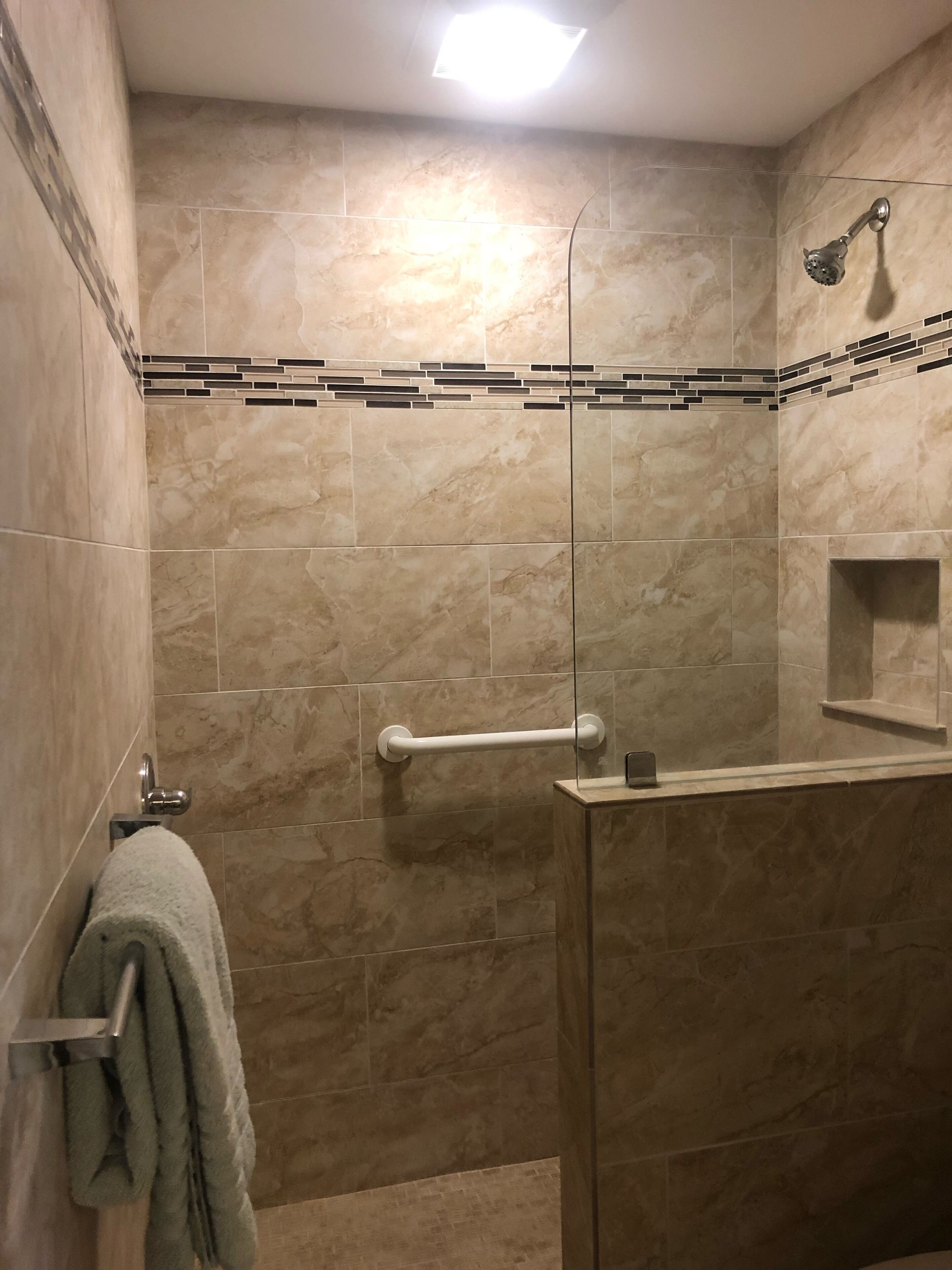 Shower, hair dryer, towels, toilet paper