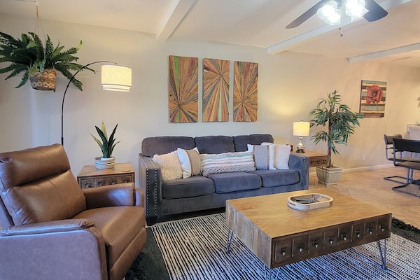 Living room features a comfortable queen size sleeper sofa