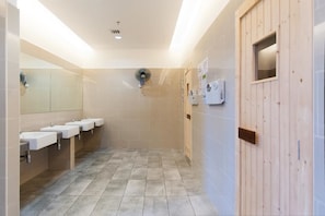 A modern bathroom with three sinks, a fan, and a wooden door. - A6 STUNNING Suites Atlantis-Pool View-Jonker Melaka (Malacca City)