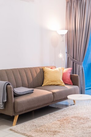 Apartment, 1 Bedroom | Living room | Flat-screen TV