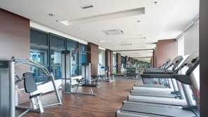 A modern gym with treadmills, elliptical machines, and weight benches. - A5 FAMILY Suites 4-6pax-Atlantis-Smart TV-Melaka-WIFI (Malacca City)