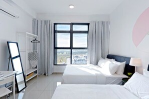 Enjoy a city view from the large window, with a comfortable bed and stylish storage space.
