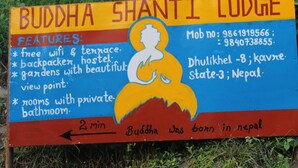 A sign for Buddha Shanti Lodge with features like free wifi, terrace, backpacker hostel, gardens, beautiful view point, and rooms with private bathroom. - Buddha Shanti Lodge Backpackers paradise (Dhulikhel)