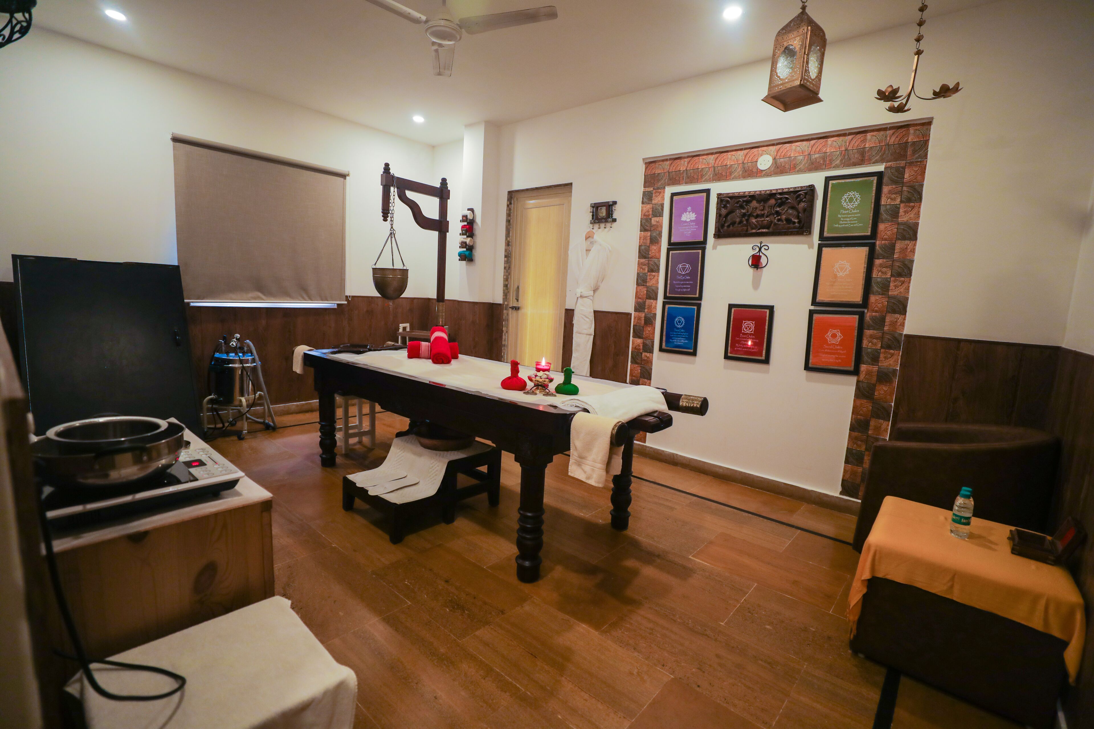 A room with a dining table, a television, and a water dispenser.