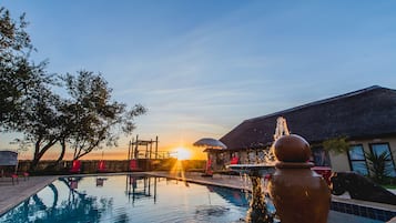 Outdoor pool, open 8:00 AM to 8:00 PM, pool umbrellas, pool loungers