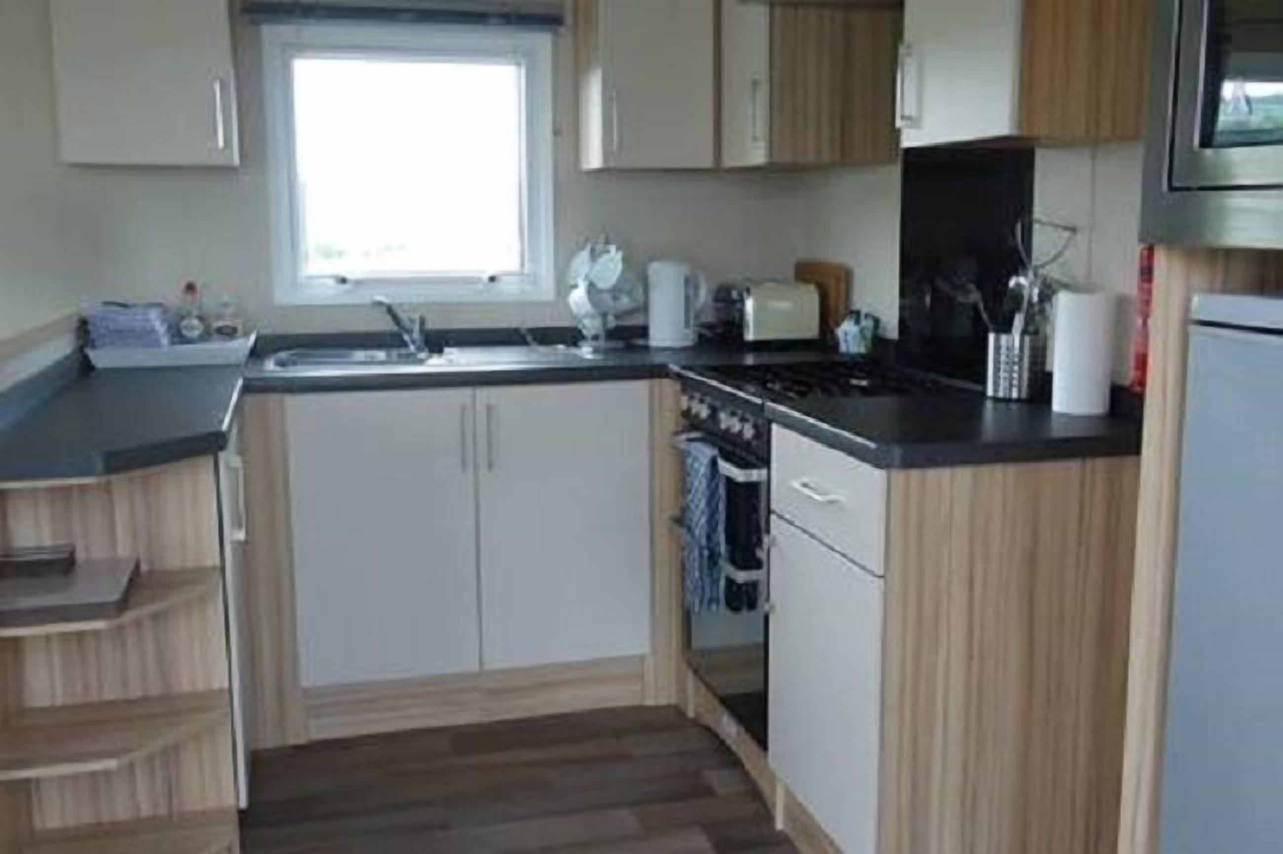 T3 Hire Caravan | Private kitchen | Full-size fridge, microwave, oven, stovetop