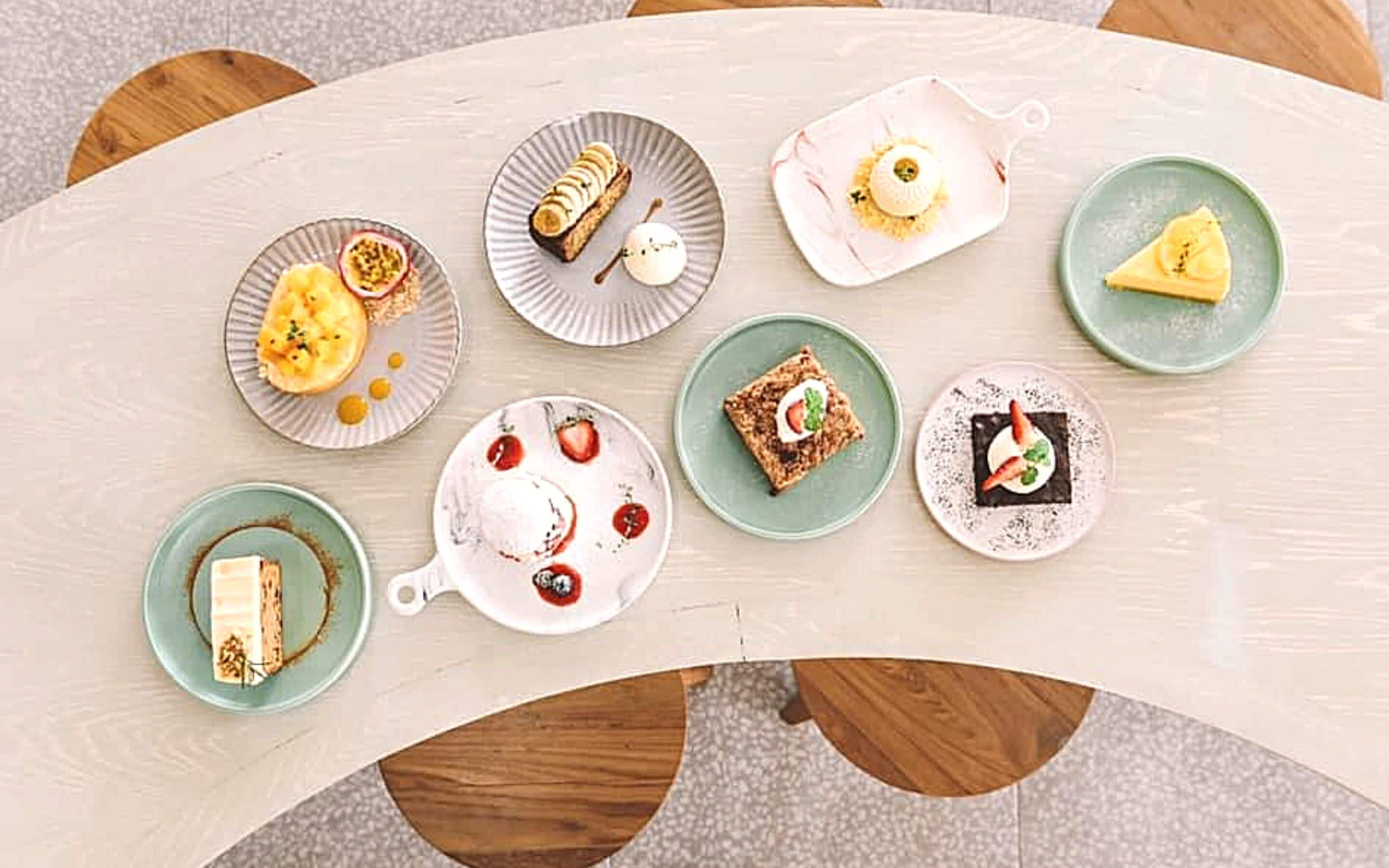 A table with various desserts and pastries.