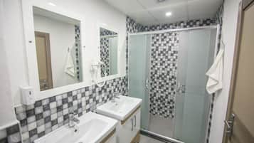 Shower, rainfall showerhead, designer toiletries, hair dryer