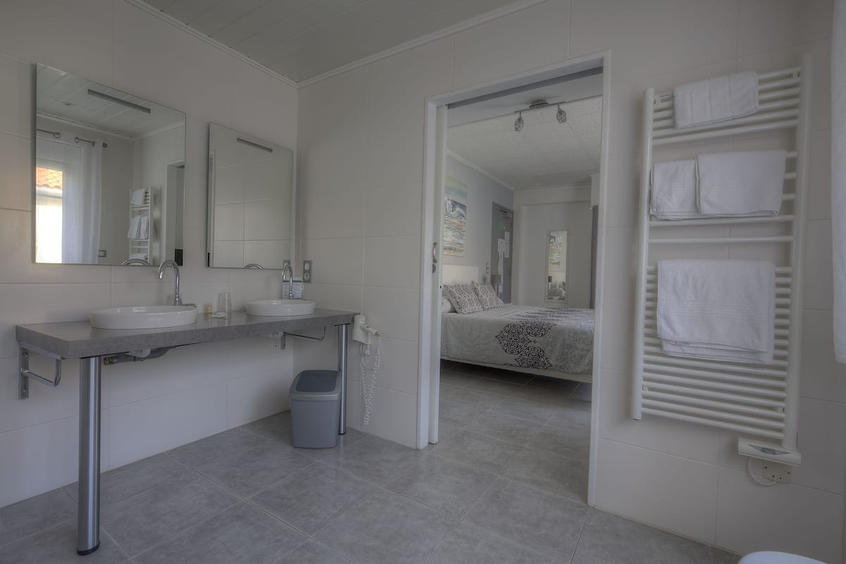 deluxe double room, 1 queen bed | bathroom | shower, free toiletries, hair dryer, towels