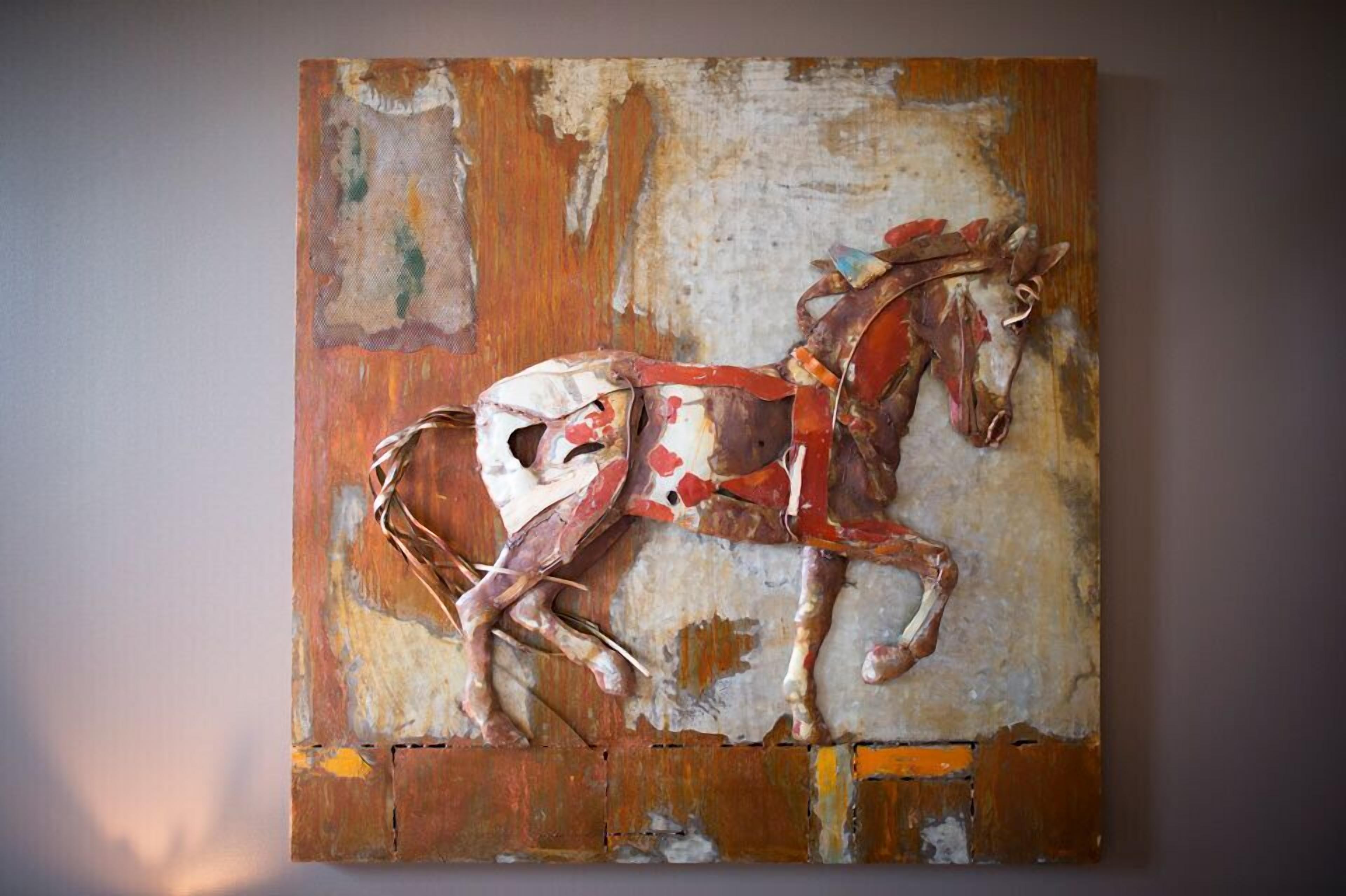 A painting of a horse on a textured wall.