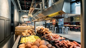 A breakfast buffet with various food items including eggs, sausages, and pastries. - J24 Hotel Milano (Milan)