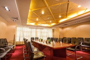 A conference room with a long table, multiple chairs, and a red carpet. - Guangyun Hotel Beijing (Beijing)