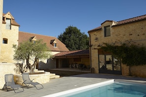 Seasonal outdoor pool, open 9:00 AM to 10:00 PM, pool umbrellas