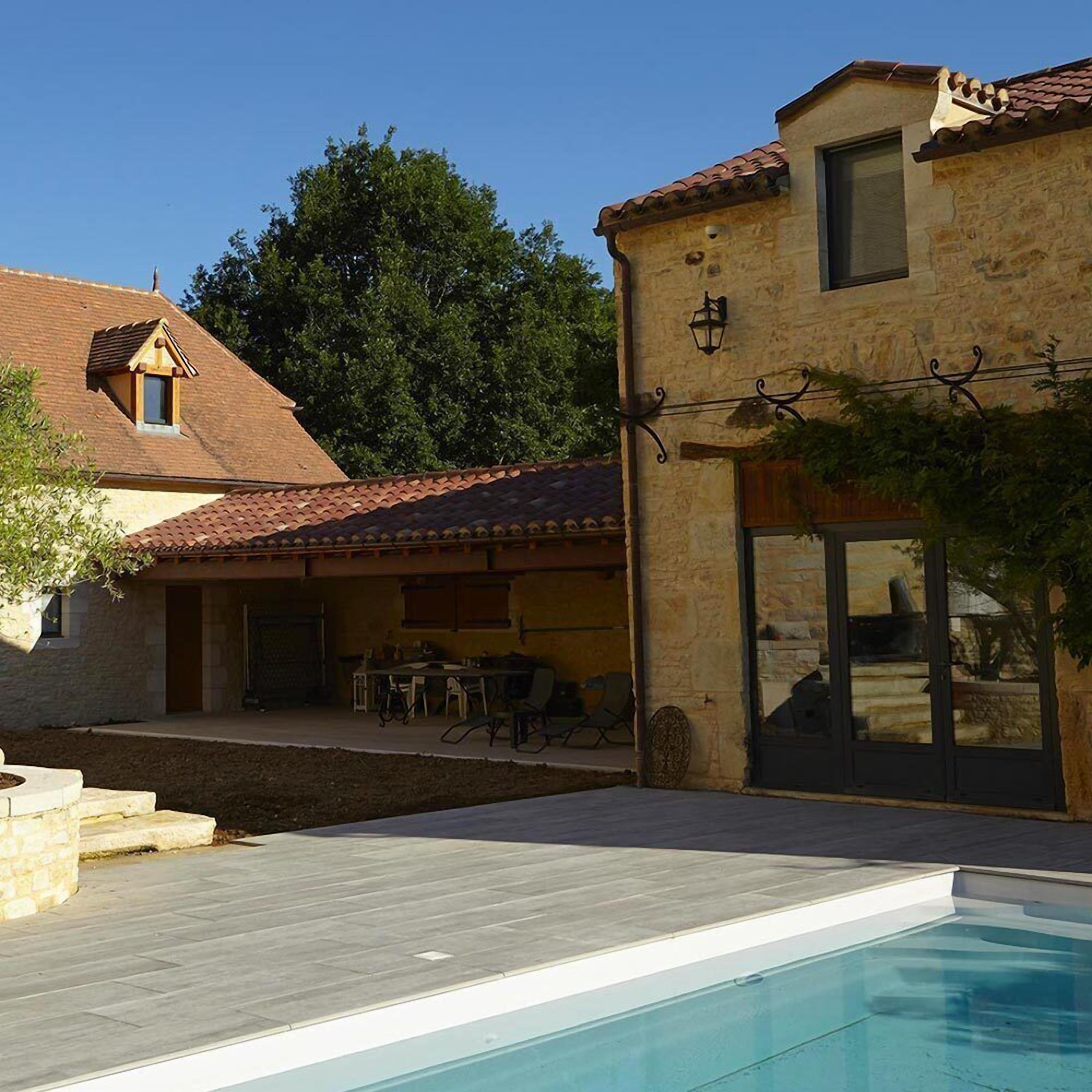 Seasonal outdoor pool, open 9:00 AM to 10:00 PM, pool umbrellas