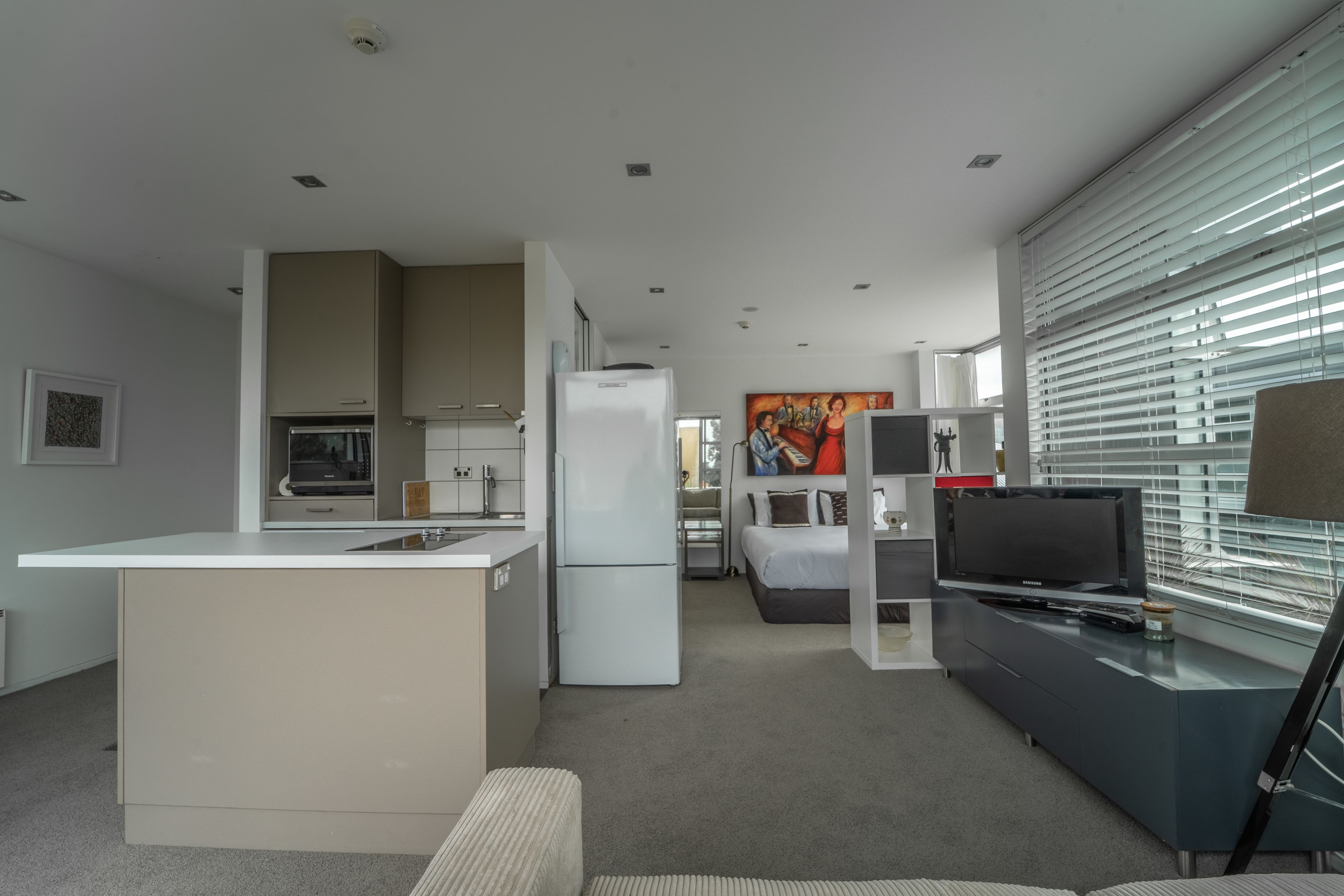 Studio Style Apartment With Balcony  | Living area | Flat-screen TV