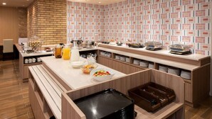 A modern kitchen with a long counter, various appliances, and storage cabinets. - Amagasaki Plaza Hotel Hanshin Amagasaki (Amagasaki)