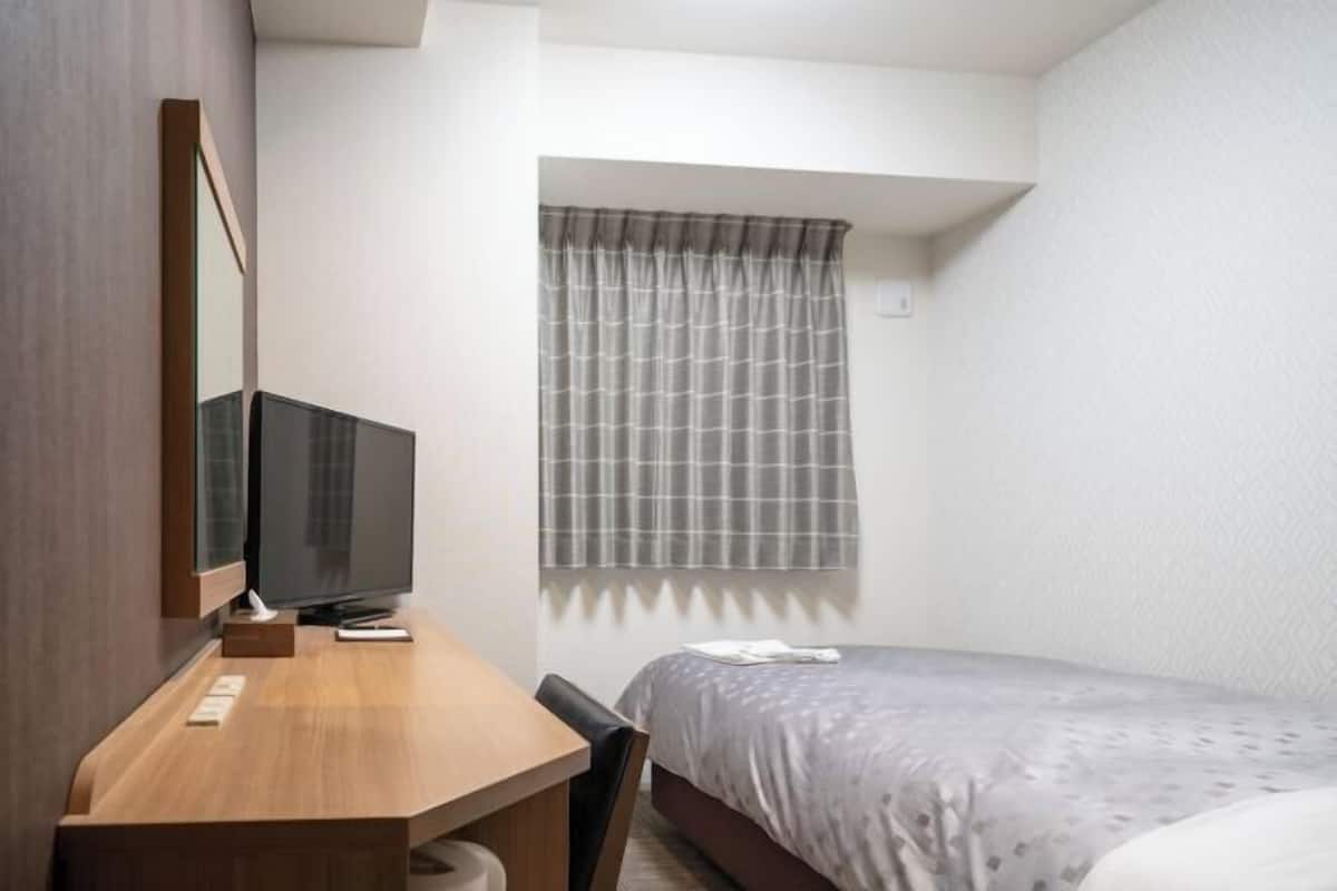 Desk, blackout curtains, free WiFi, bed sheets
